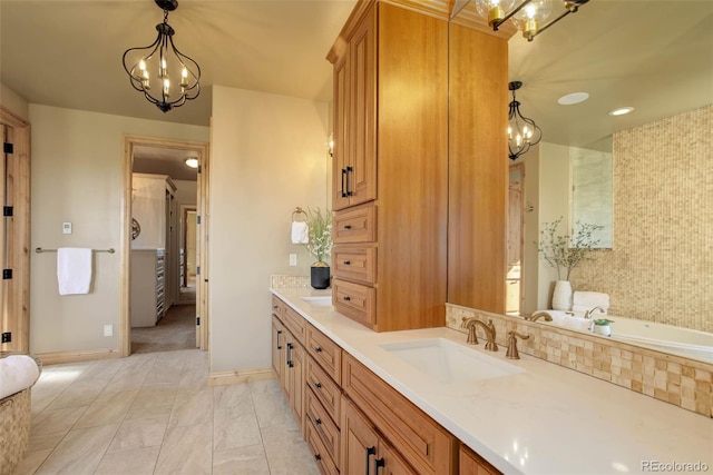 bathroom featuring vanity and a notable chandelier