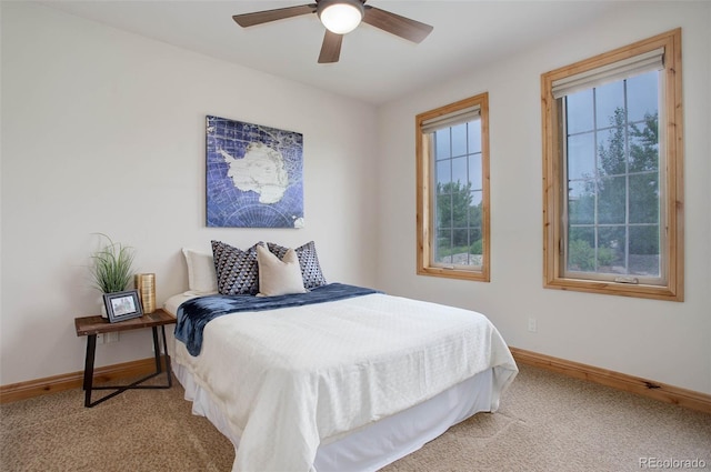 carpeted bedroom featuring ceiling fan