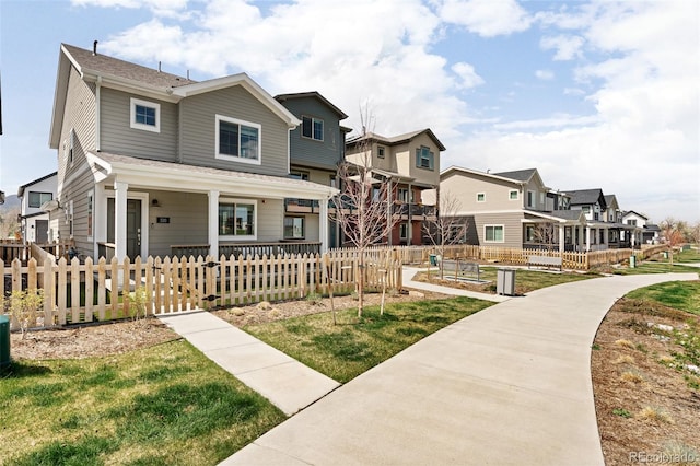 320 Marshall Mews, Superior, CO 80027 - view of front of property with a residential view, a fenced front yard, and covered porch