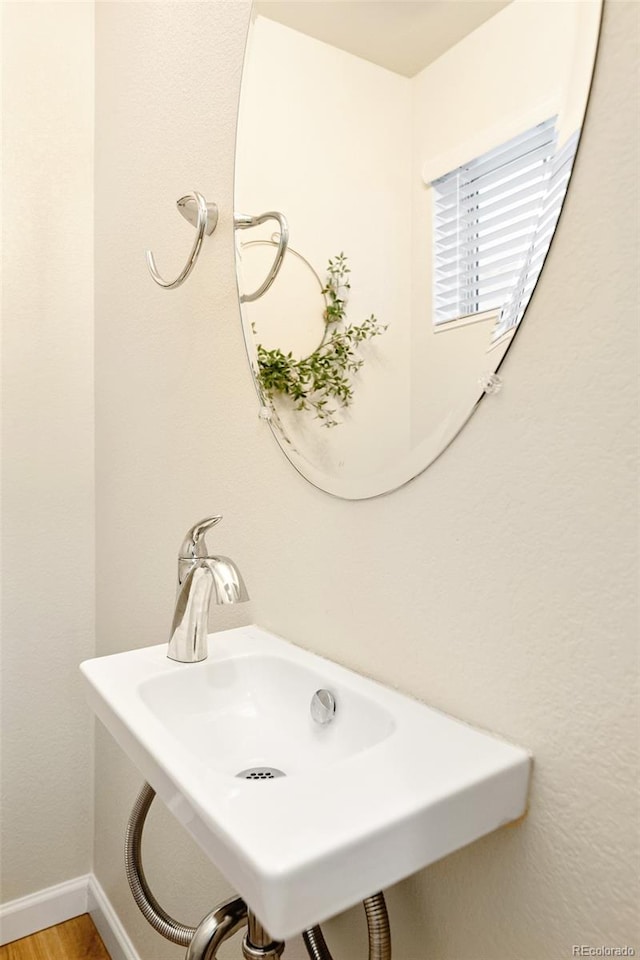 320 Marshall Mews, Superior, CO 80027 - bathroom with wood finished floors, a sink, and baseboards