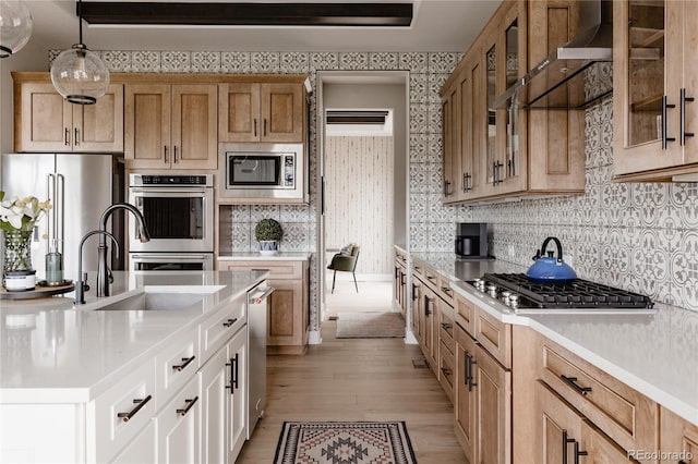 kitchen with light countertops, a sink, and stainless steel appliances