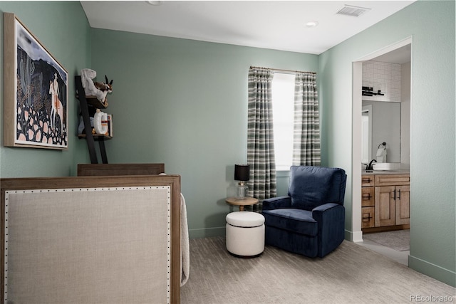 living area featuring visible vents, baseboards, and carpet floors