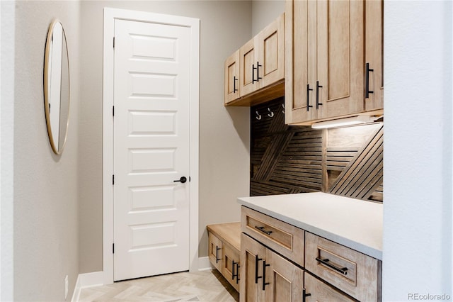 mudroom featuring baseboards