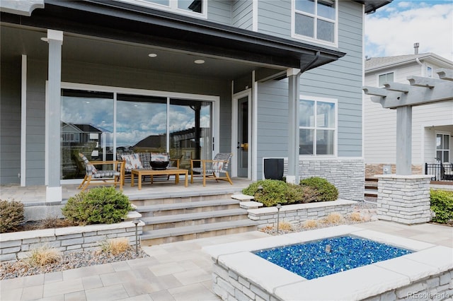 exterior space featuring covered porch and stone siding