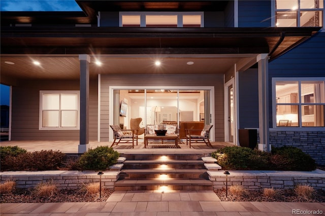 view of patio with an outdoor hangout area and a porch