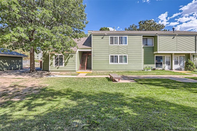940 S Peoria St, Aurora, CO 80012 - view of front of house featuring a front lawn, stairs, and a shingled roof