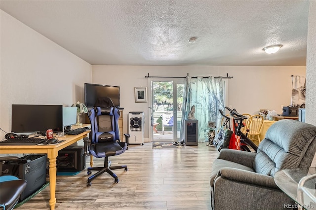 940 S Peoria St, Aurora, CO 80012 - office featuring wood finished floors and a textured ceiling