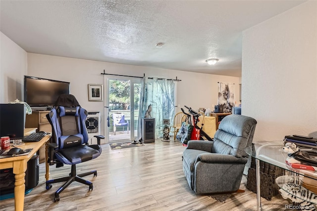 940 S Peoria St, Aurora, CO 80012 - office space featuring wood finished floors and a textured ceiling