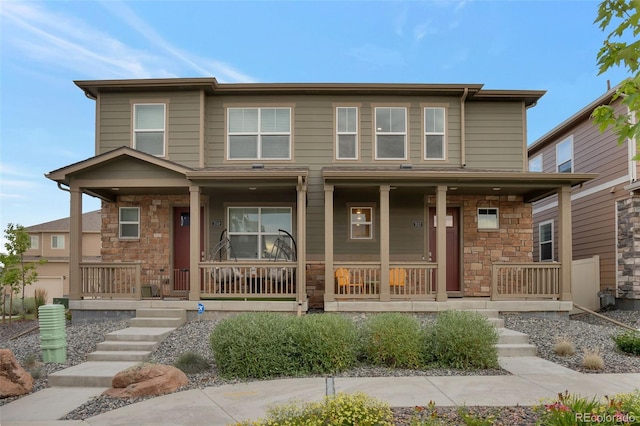 7017 Kali Ct, Frederick, CO 80530 - view of front of house with covered porch and stone siding