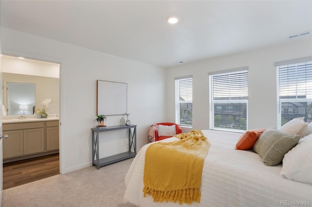7017 Kali Ct, Frederick, CO 80530 - bedroom with light carpet, connected bathroom, and recessed lighting