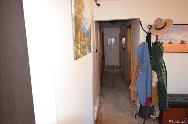 corridor featuring carpet flooring and visible vents