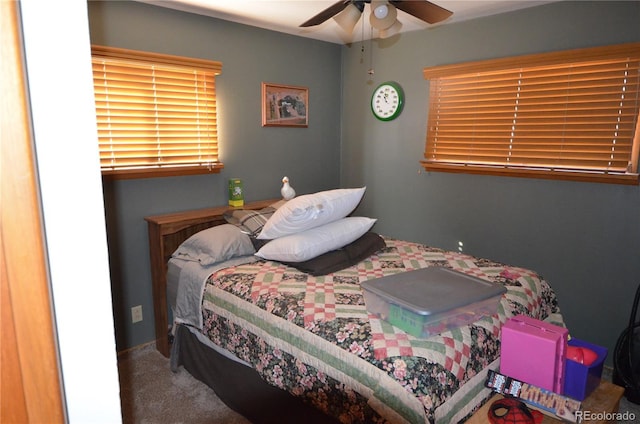 carpeted bedroom featuring a ceiling fan