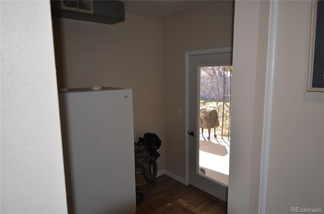 entryway with wood finished floors