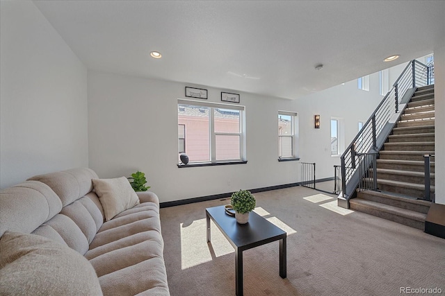 6047 N Nepal Ct, Aurora, CO 80019 - carpeted living room featuring stairway and recessed lighting