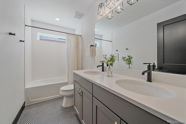 6047 N Nepal Ct, Aurora, CO 80019 - bathroom featuring double vanity, shower / bath combo, and tile patterned floors