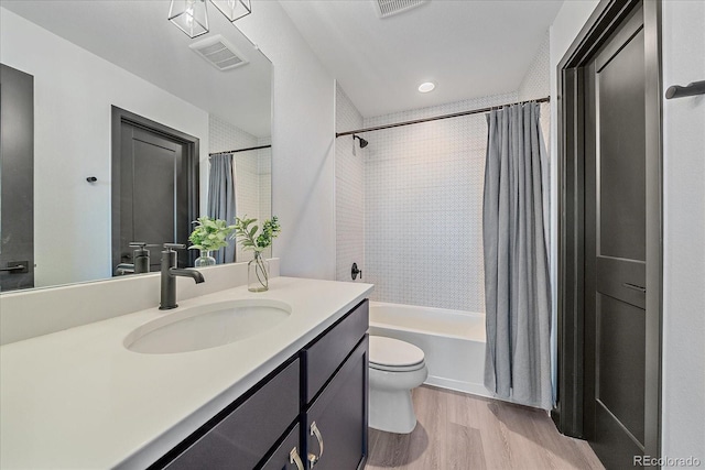 6047 N Nepal Ct, Aurora, CO 80019 - bathroom with wood finished floors, vanity, and shower / bathtub combination with curtain