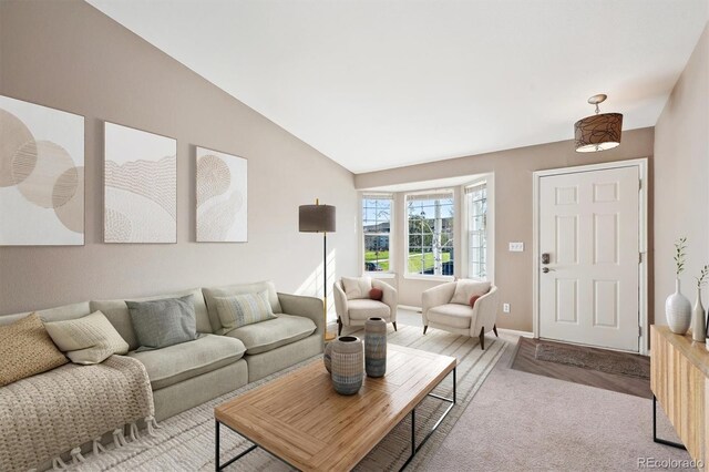 2905 E Yarrow Cir, Superior, CO 80027 - carpeted living area featuring vaulted ceiling and baseboards