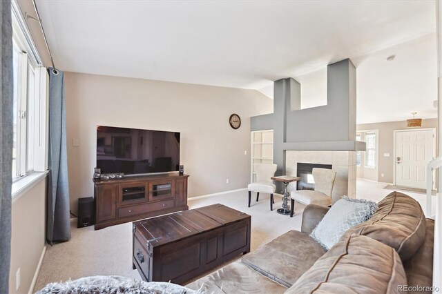 2905 E Yarrow Cir, Superior, CO 80027 - carpeted living area with baseboards, a tiled fireplace, and lofted ceiling