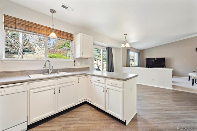 2905 E Yarrow Cir, Superior, CO 80027 - kitchen featuring white dishwasher, a sink, white cabinets, light wood-type flooring, and light countertops