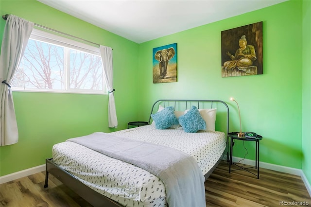 bedroom with hardwood / wood-style floors