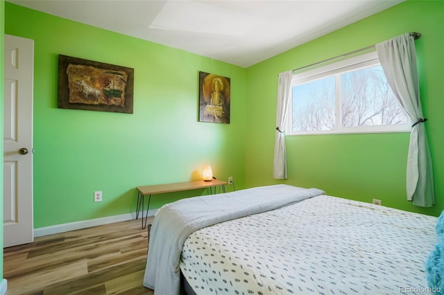 bedroom featuring hardwood / wood-style floors