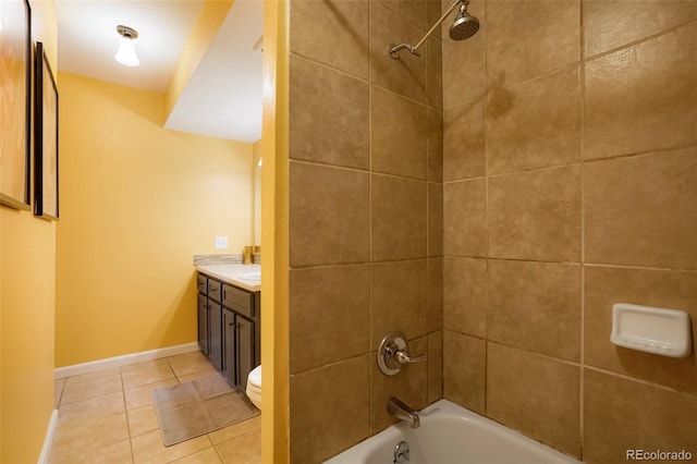 full bathroom featuring tile patterned floors, tiled shower / bath combo, toilet, and vanity