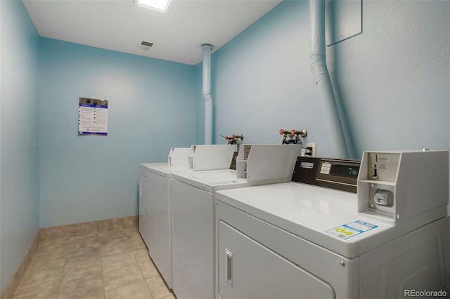 clothes washing area featuring washing machine and dryer