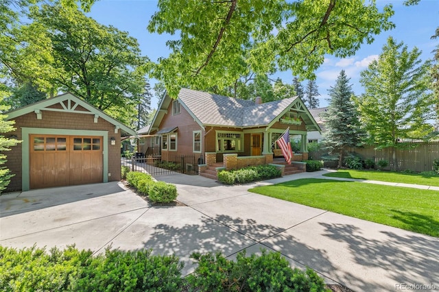 13 2nd St, Colorado Springs, CO 80906 - view of front facade with an outbuilding, driveway, a garage, and a chimney