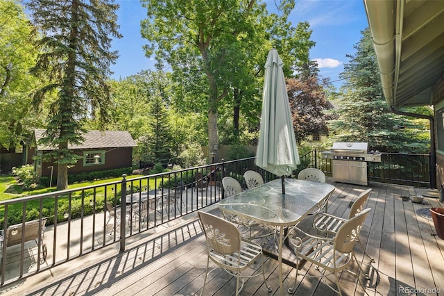 13 2nd St, Colorado Springs, CO 80906 - wooden deck with outdoor dining area