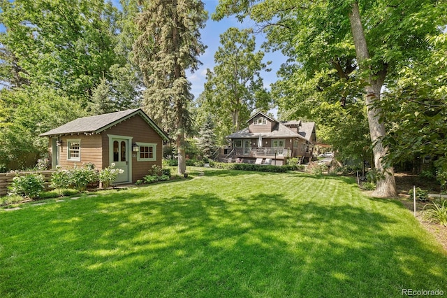 13 2nd St, Colorado Springs, CO 80906 - view of grassy yard featuring an outdoor structure and a wooden deck