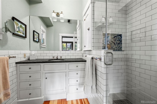 13 2nd St, Colorado Springs, CO 80906 - full bathroom with tile walls, vanity, and a stall shower