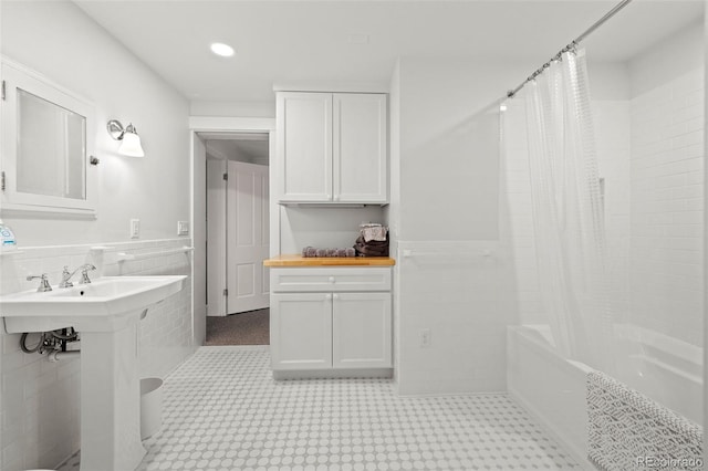 13 2nd St, Colorado Springs, CO 80906 - bathroom with shower / bath combination with curtain, tile walls, a wainscoted wall, and recessed lighting