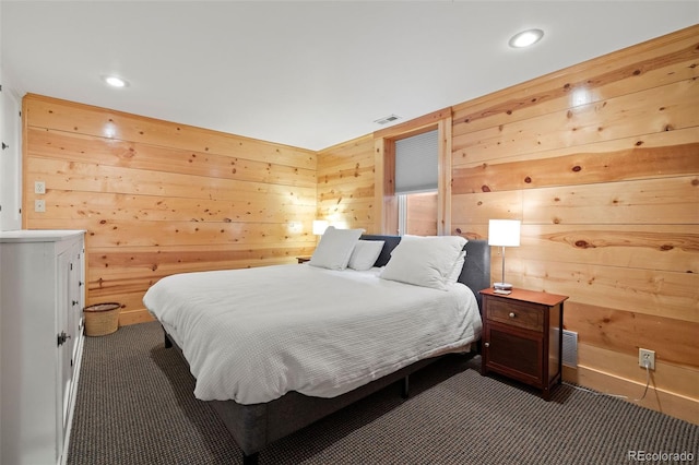 13 2nd St, Colorado Springs, CO 80906 - carpeted bedroom with wood walls and recessed lighting