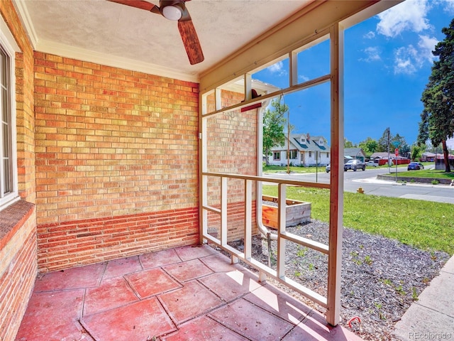 1600 Xanthia St, Denver, CO 80220 - unfurnished sunroom featuring ceiling fan and a residential view