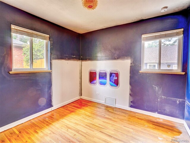 1600 Xanthia St, Denver, CO 80220 - unfurnished room with wood finished floors, baseboards, and a smoke detector