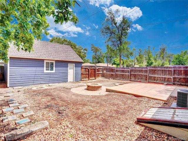 1600 Xanthia St, Denver, CO 80220 - fenced backyard with an outdoor fire pit, central air condition unit, and a patio