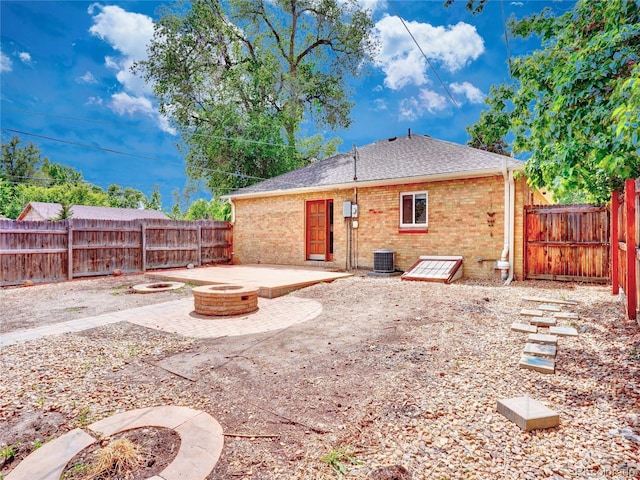 1600 Xanthia St, Denver, CO 80220 - rear view of property with an outdoor fire pit, a patio, central air condition unit, and a fenced backyard