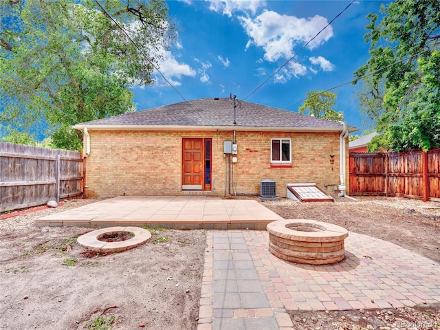1600 Xanthia St, Denver, CO 80220 - rear view of property featuring an outdoor fire pit, a patio, and a fenced backyard