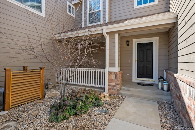 doorway to property featuring a porch