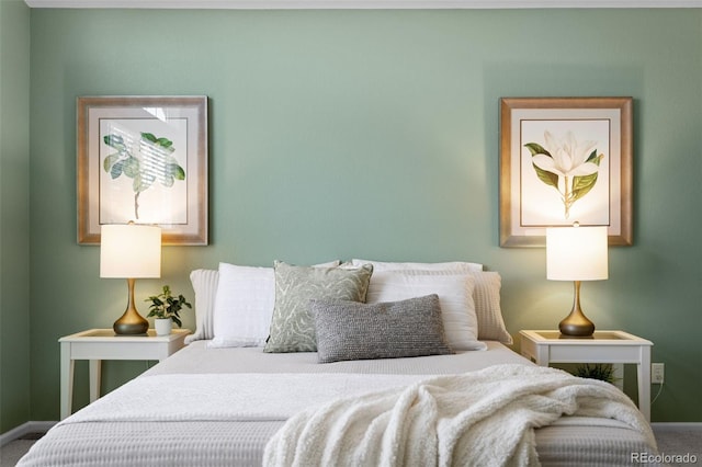 carpeted bedroom featuring baseboards