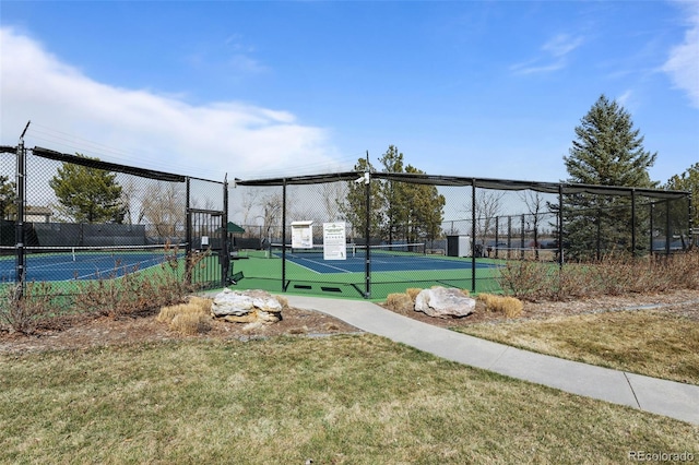 view of tennis court with fence