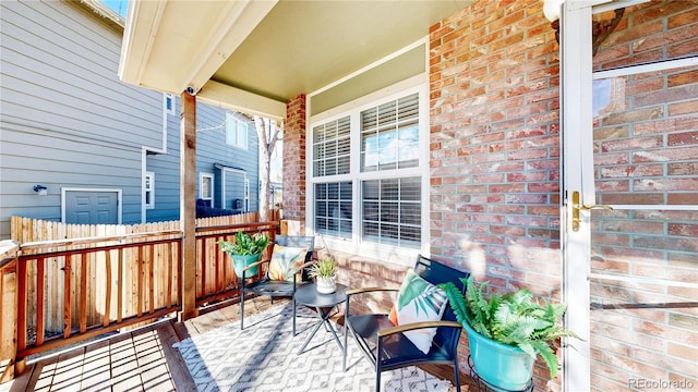 exterior space with fence and a porch