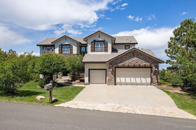 6299 Ellingwood Point Pl, Castle Rock, CO 80108 - traditional-style home with stone siding, stucco siding, concrete driveway, a tiled roof, and a front yard
