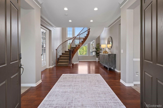 6299 Ellingwood Point Pl, Castle Rock, CO 80108 - entryway with recessed lighting, dark wood finished floors, stairway, and ornamental molding