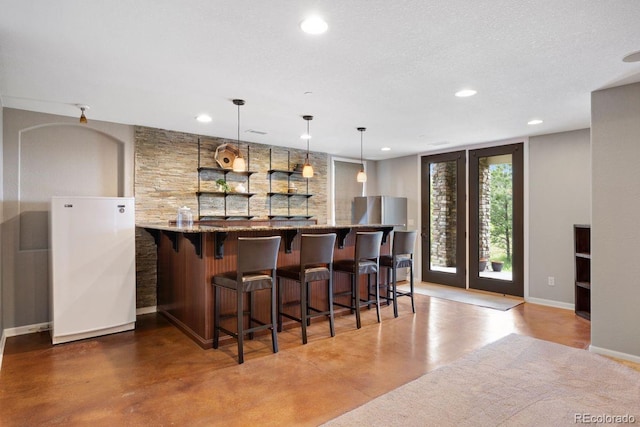 6299 Ellingwood Point Pl, Castle Rock, CO 80108 - indoor bar with recessed lighting, decorative light fixtures, and concrete flooring