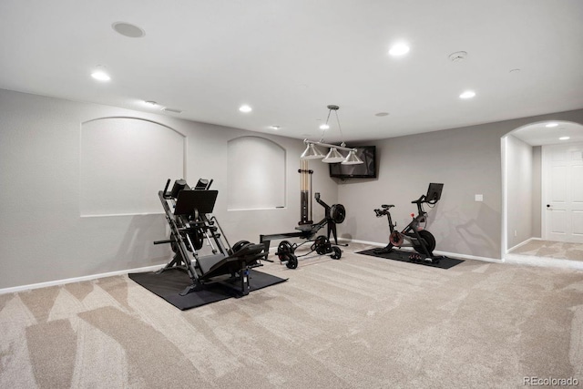 6299 Ellingwood Point Pl, Castle Rock, CO 80108 - exercise room with arched walkways, carpet, and recessed lighting