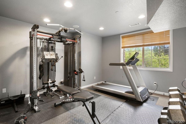 6299 Ellingwood Point Pl, Castle Rock, CO 80108 - exercise area featuring recessed lighting and a textured ceiling