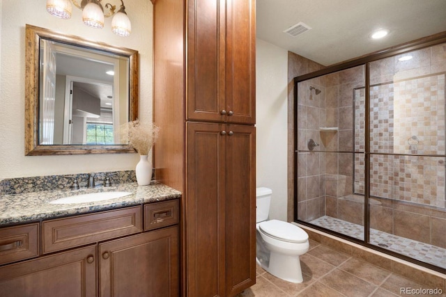 6299 Ellingwood Point Pl, Castle Rock, CO 80108 - bathroom featuring a stall shower, vanity, tile patterned flooring, and recessed lighting