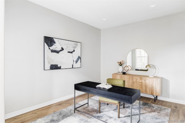 office featuring recessed lighting, baseboards, and wood finished floors