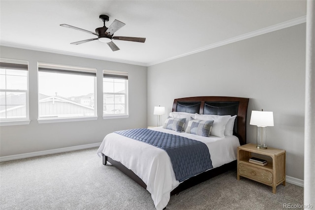 bedroom with carpet flooring, a ceiling fan, crown molding, and baseboards